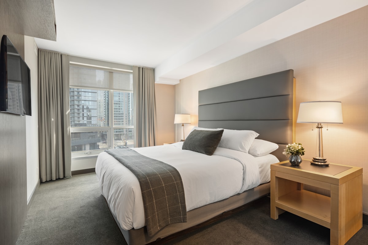 Interior decoration Dubai bedroom with bespoke headboard and layered lighting