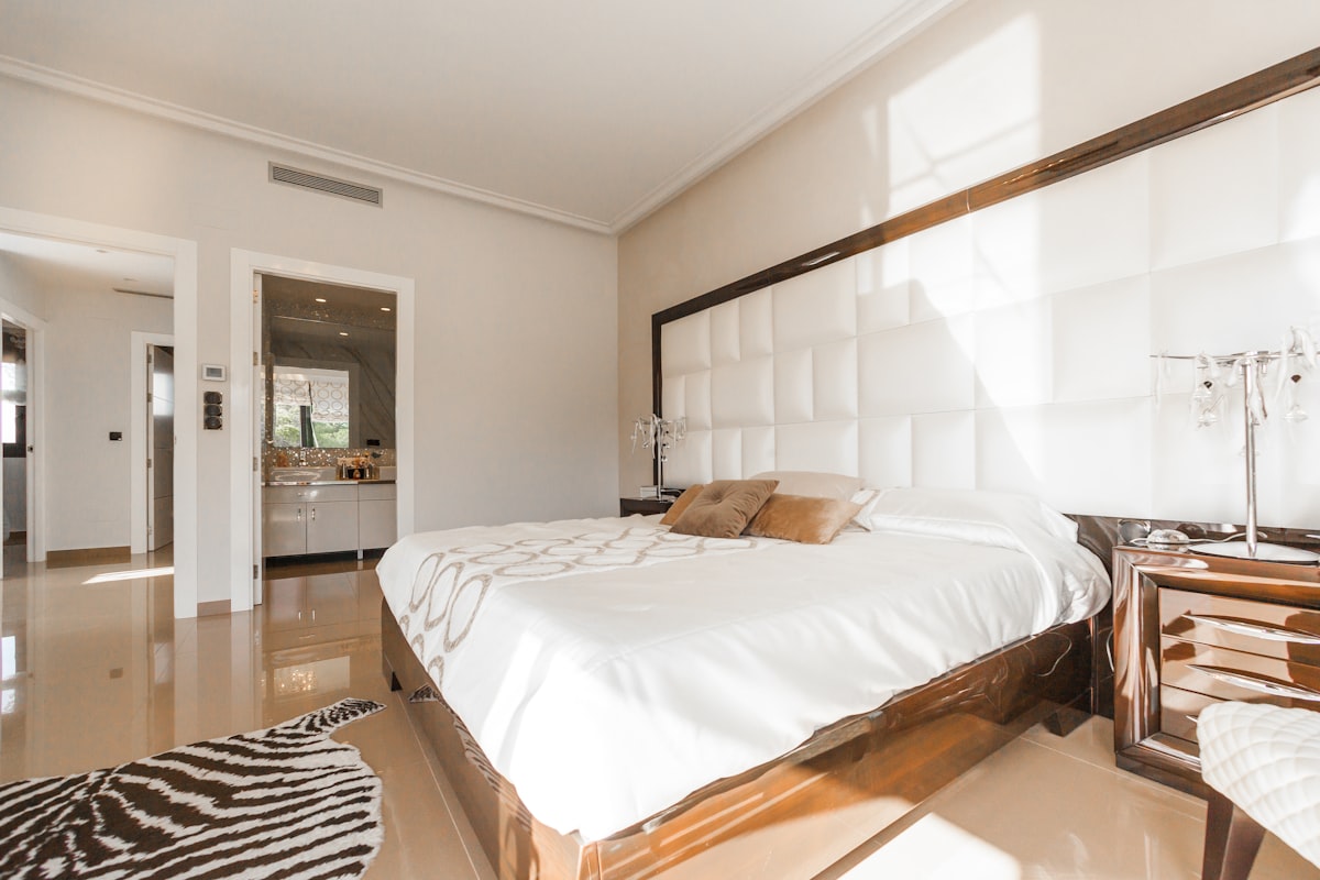 Hotel interior design Dubai luxury suite bedroom with panelled headboard