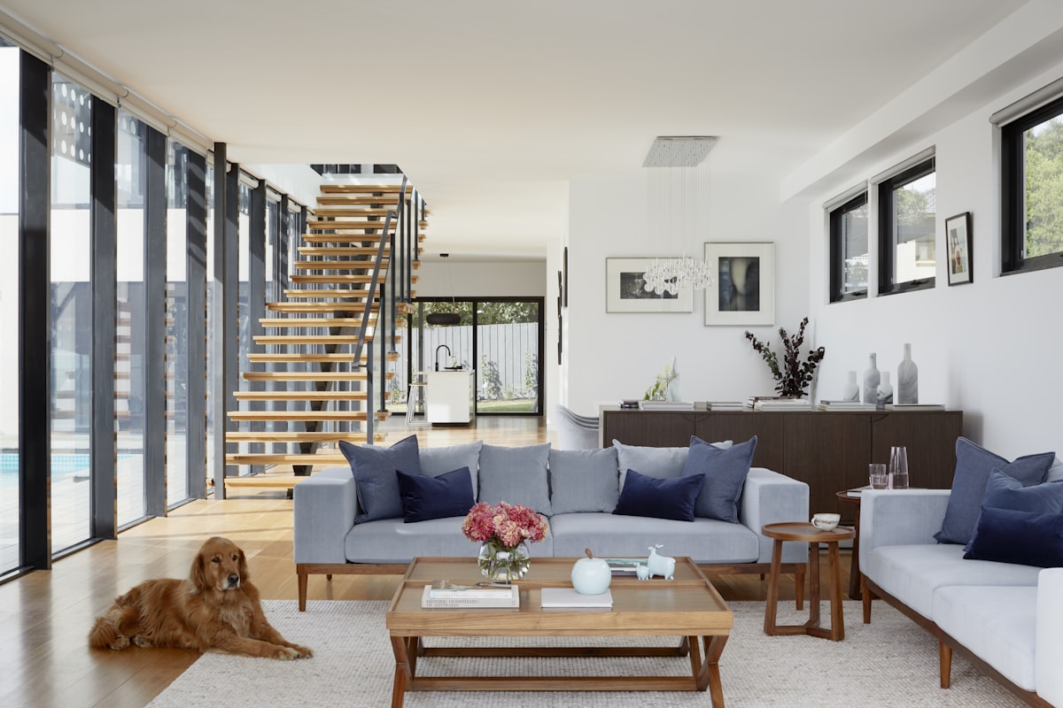 Modern interior design Dubai warm minimalist living room with floating staircase