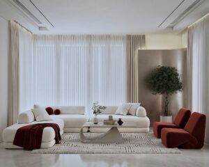 UAE interior design living room featuring terracotta accent chairs and neutral palette